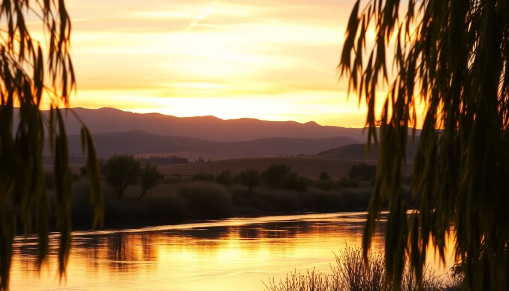 View of the tranquil river in Clarksburg, CA, during a stunning sunset reflecting vibrant colors.